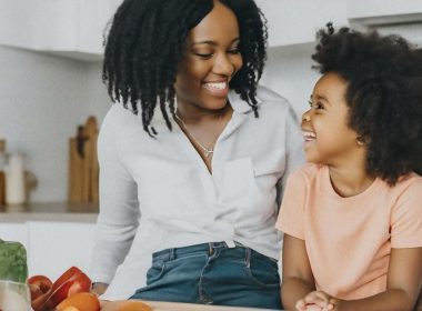 Mother and child talking in the kitchen